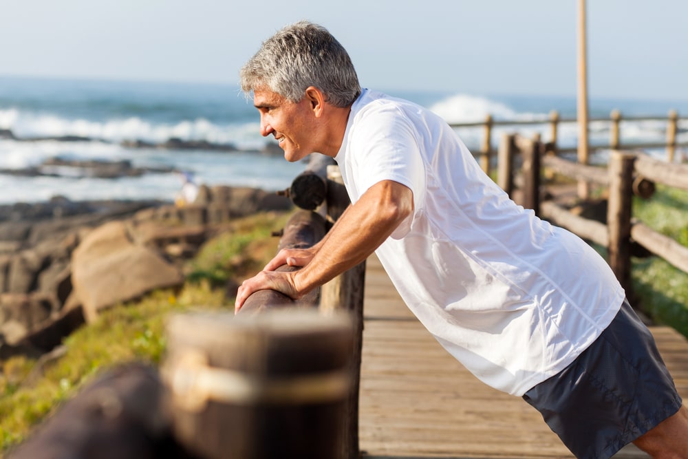 Fit,Senior,Man,Exercising,At,The,Beach,In,The,Morning